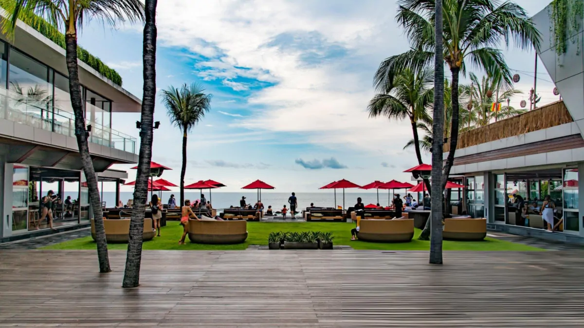 Canggu Bali beach club scene with modern lifestyle atmosphere and social crowd