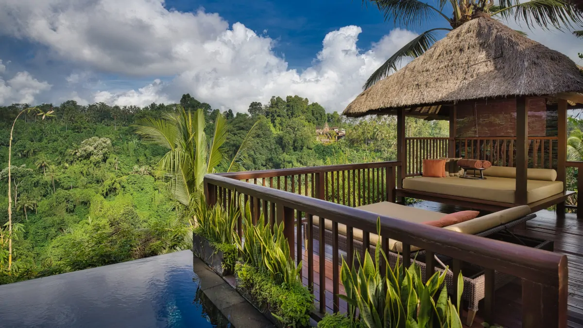 Hanging Gardens of Bali villa terrace with infinity pool overlooking rainforest valley in Ubud