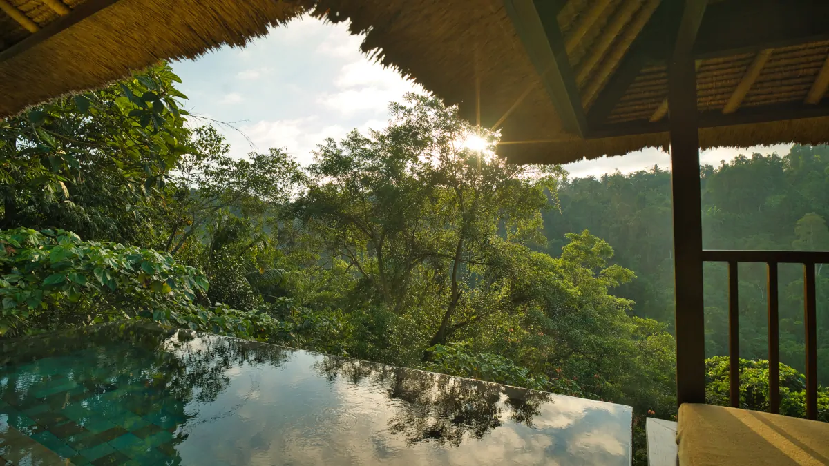 Hanging Gardens of Bali villa terrace overlooking rainforest valley with private infinity pool