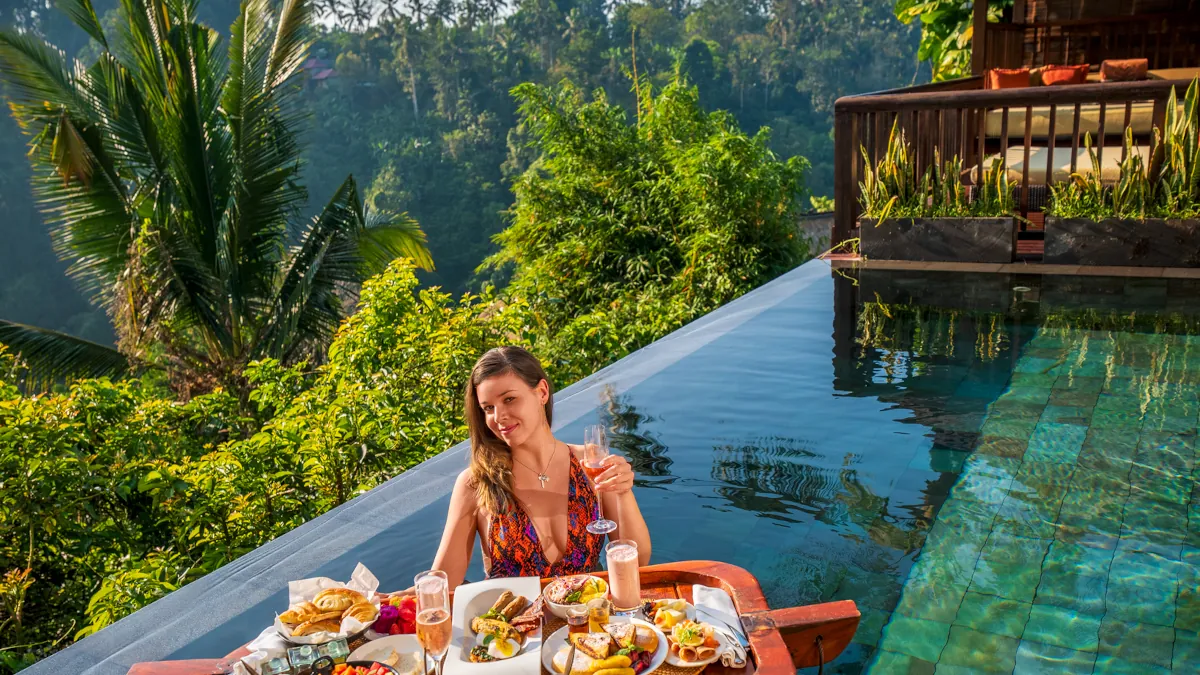 Luxury breakfast overlooking rainforest from a private villa in Ubud Bali