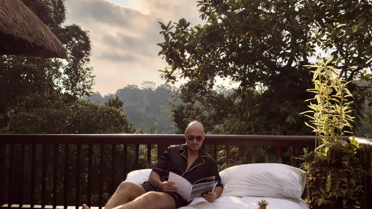 Relaxing beside a private infinity pool in Ubud Bali rainforest
